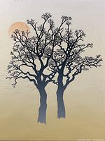 Close view of the print showing two tree silhouettes and sun