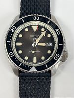 Front view of Seiko 5 automatic watch showing dial, bezel and hands
