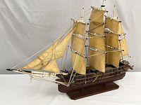 Full starboard side view of model ship on stand