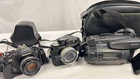 Group shot showing Nikon FG with lens, Nikonos II, Sony CCD-TR700 and Sony carry bag