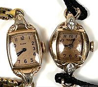 Front view showing both wristwatches, dial details, diamond accents