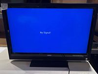 Front view of Vizio VO370M TV powered on showing No Signal message