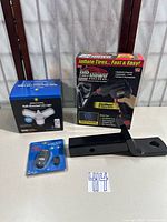 All four items: Air Hawk Pro inflator box, Brightliving LED light box, Toyota hitch mount, infrared thermometer blister pack