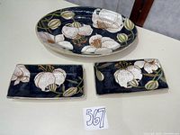 Overview of oval platter and two rectangular dishes on table