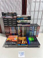 All DVDs and box sets displayed together on table