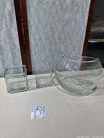 All three glass vases displayed side by side