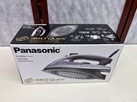 Retail box front showing Panasonic NI-W950A model and imagery