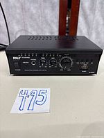 Front of Pyle PCA series amplifier showing controls, USB and SD inputs, headphone jack and volume knob