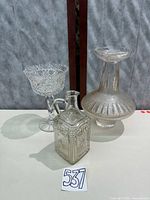 Group view of three glass pieces