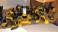 Shelf with numerous DeWalt cordless tools and batteries