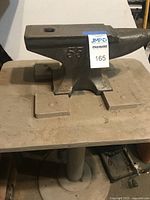 Anvil atop stand showing overall form and mounting
