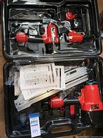 Open case showing both nailers, manuals and accessories