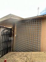 Concrete mesh panels mounted on exterior wall