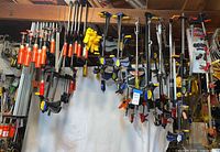 Wide view of clamps hanging, showing variety and quantity
