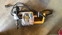 Full view left side of DeWalt DWD460 drill with cord coiled