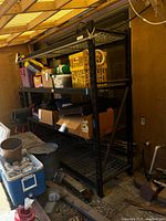 Full view of assembled black metal rack outdoors