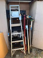 Overall view showing ladder, jacks, crates with tools