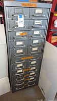 Front view of full gray 18-drawer cabinet