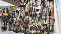Full pegboard wall densely packed with assorted hand tools