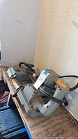 Two Porter-Cable portable band saws on bench