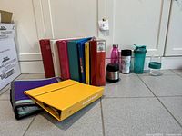 Group shot of binders and drinkware