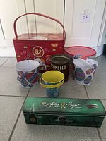Group shot of all tins and buckets together