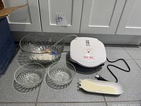 Large serving bowl, two small bowls, electric grill, drip tray