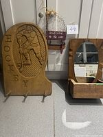 Front view of hockey plaque and mirror shelf beside cabinet