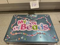 Closed tin showing lid graphics