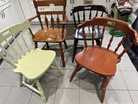 All four spindle-back chairs grouped together