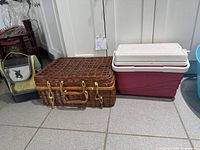 All three items side by side: lunch bag, wicker basket, Thermos cooler