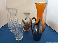 Front view of all five decorative vessels