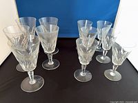 Front view of all 11 Baccarat Carcassonne glasses