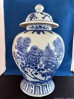 Full view of ginger jar with lid, front floral and bird design visible