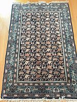 Full view of rug showing entire pattern and borders