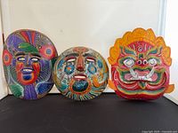 Three masks front view on black surface