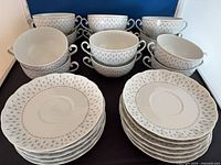 Front view of all cups and saucers displayed
