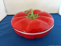 top view of tomato-shaped casserole showing lid and stem handle
