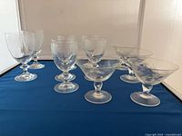 Front view of all 11 etched stemware pieces