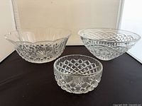 Front view of three crystal bowls showing sizes and rim styles