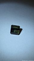 Front view of square green tourmaline showing cut and colour