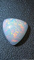 Trillion cabochon Ethiopian fire opal showing play-of-color
