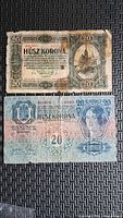 Both 20 Korona notes front sides visible