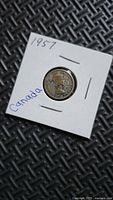 Obverse of 1957 Canadian dime in flip