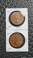 Both 1961 and 1966 pennies in holders