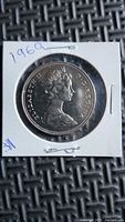 Obverse of 1969 Canadian dollar in holder