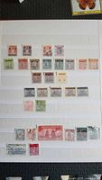 Album page with two rows of mid-century definitives and commemoratives