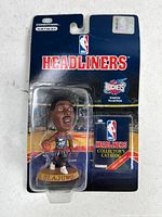Front view of sealed Hakeem Olajuwon NBA Headliners figure on card
