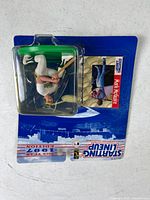 Front view of sealed Starting Lineup Mark McGuire figure with player card on blue backing