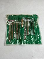 Front view of pouch showing 11 tools inside